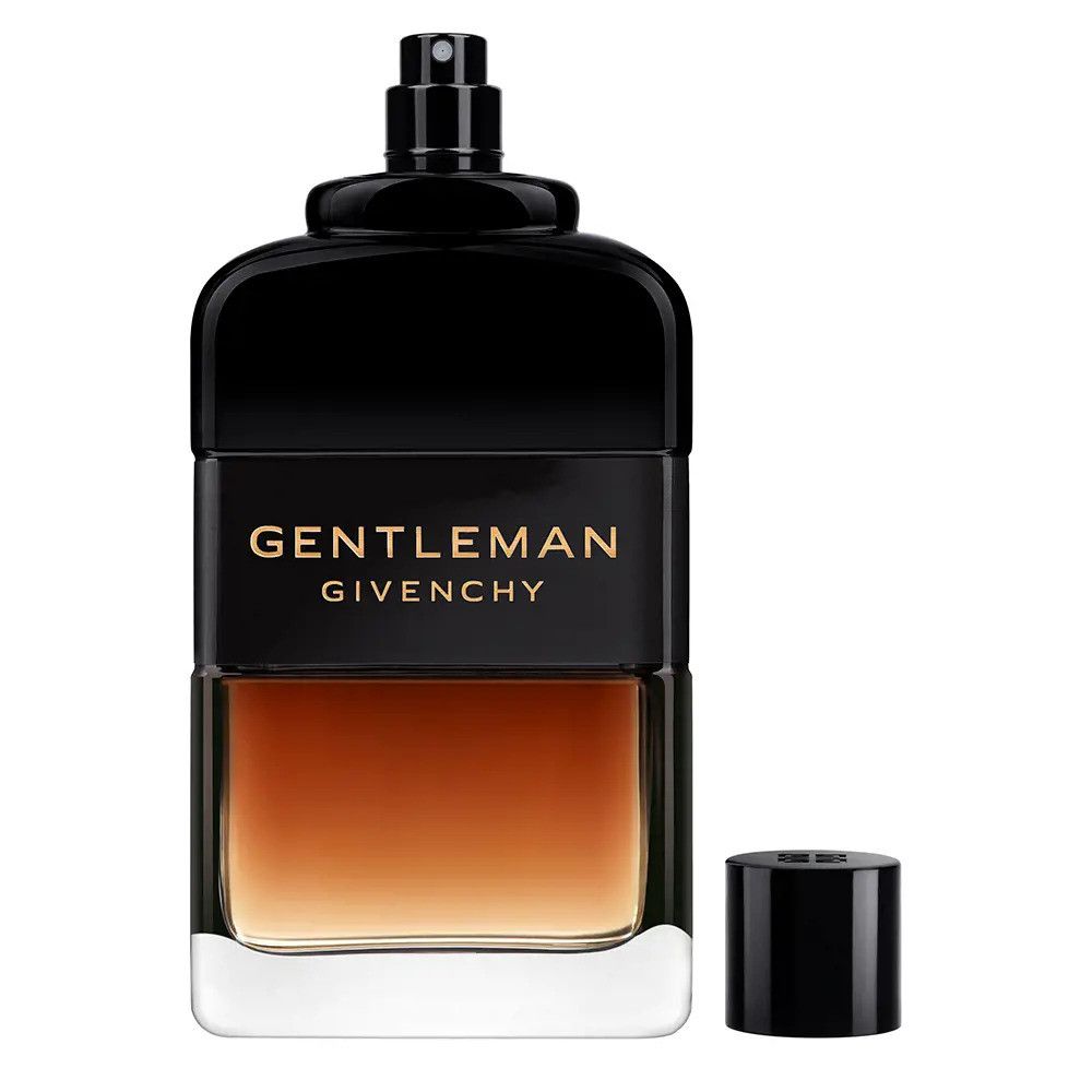 Zwarte parfumfles met dop. Opschrift GENTLEMAN GIVENCHY. Bruin naar transparant verloop.