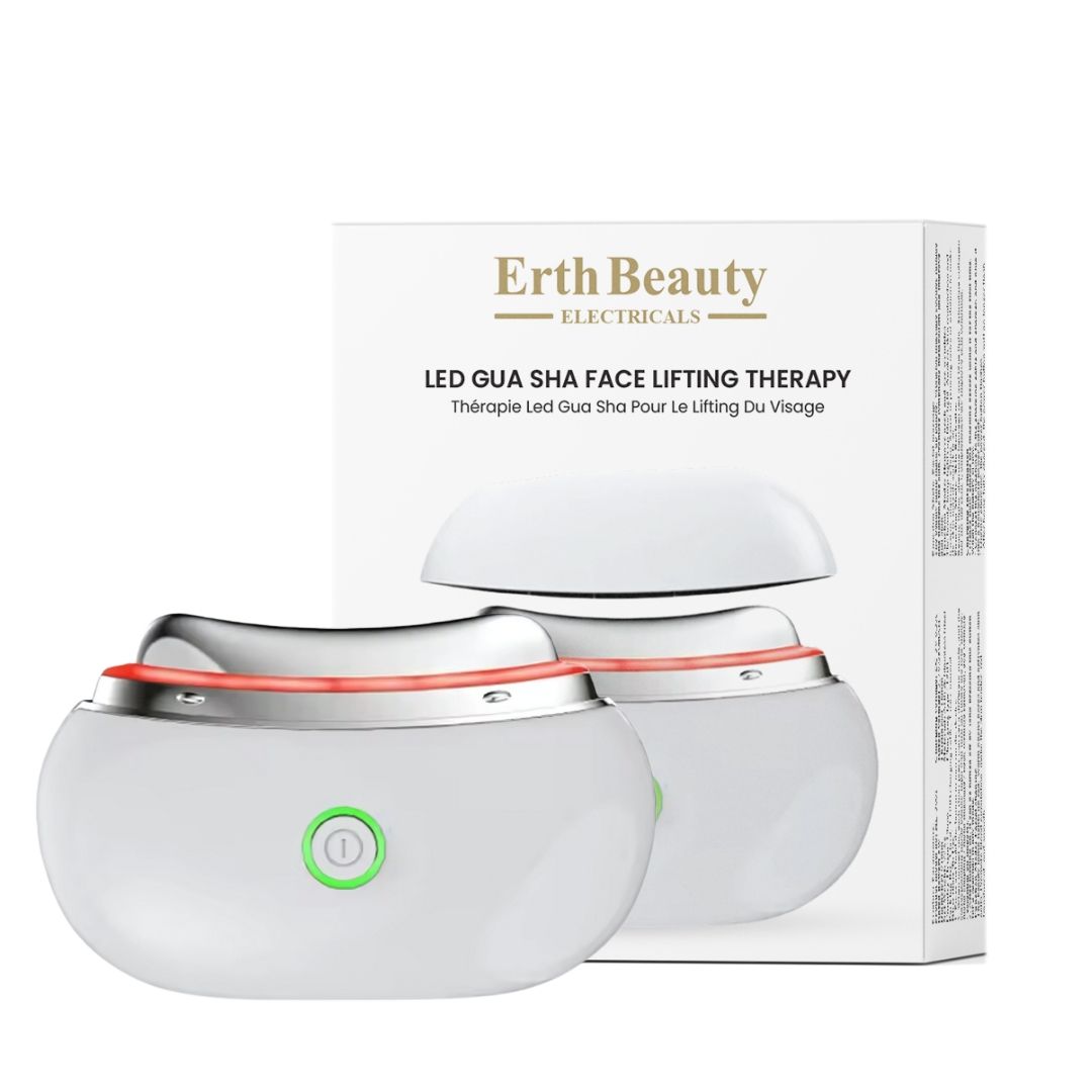 Wit LED Gua Sha Lifting apparaat met zilveren rand en groene aan/uit-knop. Verpakking op de achtergrond.