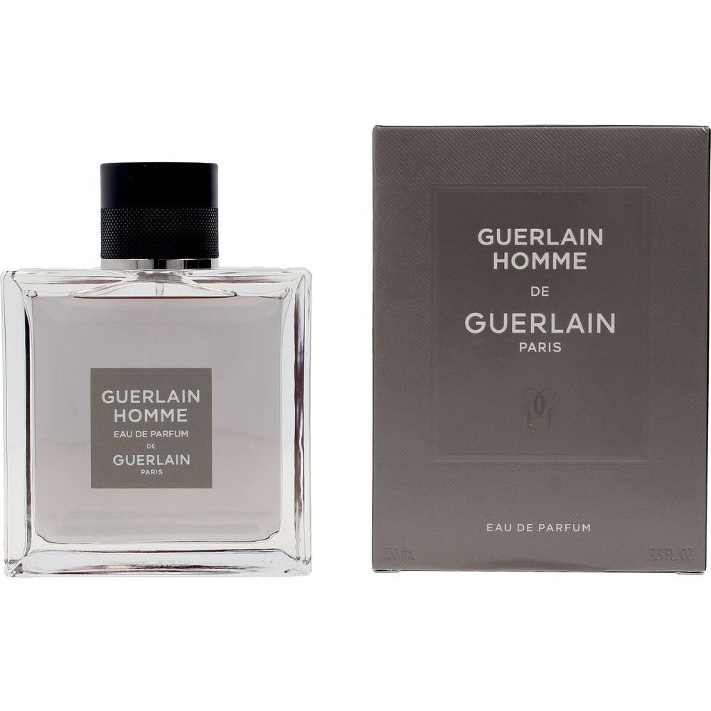 Flacon en verre avec bouchon noir et emballage rectangulaire. Inscription : Guerlain Homme, Eau de Parfum, Guerlain Paris.
