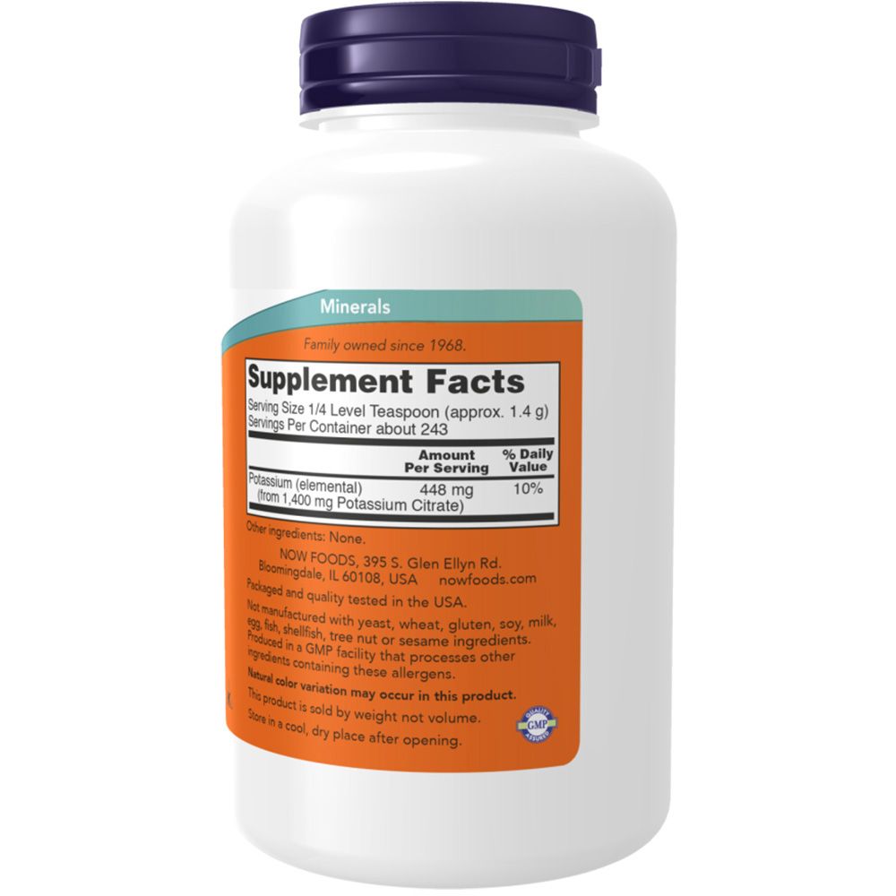 Dos d'un flacon blanc. Étiquette orange avec informations nutritionnelles. Contient des informations sur le potassium. Marque : NOW. Fabriqué aux États-Unis.