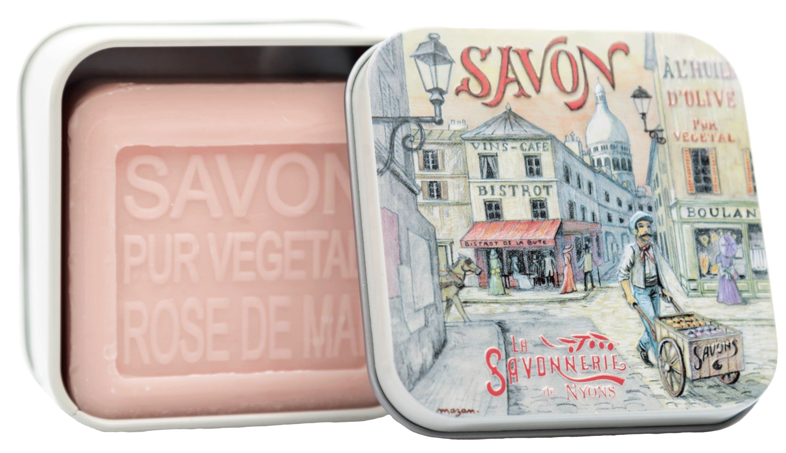 Boîte métallique ouverte avec savon. Savon rose, rectangulaire, avec inscription "SAVON". Boîte avec scène de rue.