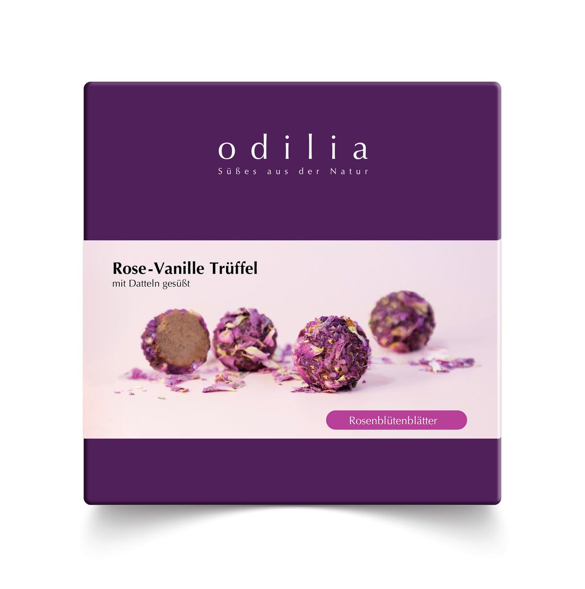 Emballage de quatre truffes Rose-Vanille, saupoudrées de pétales de rose.
