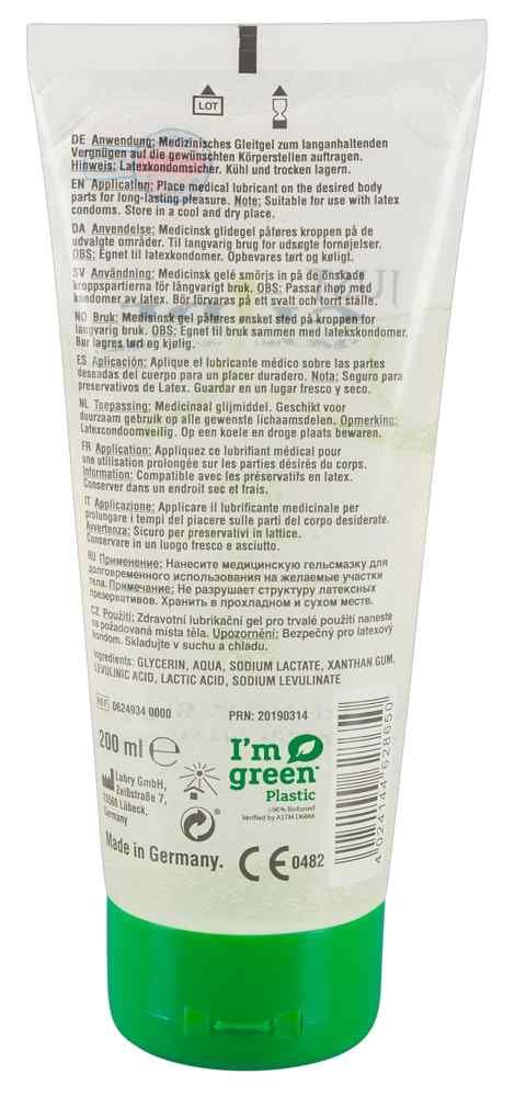 Dos d'un tube transparent avec bouchon vert. Texte: Utilisation, ingrédients, fabricant. Labels: I'm green plastic, CE 0482.