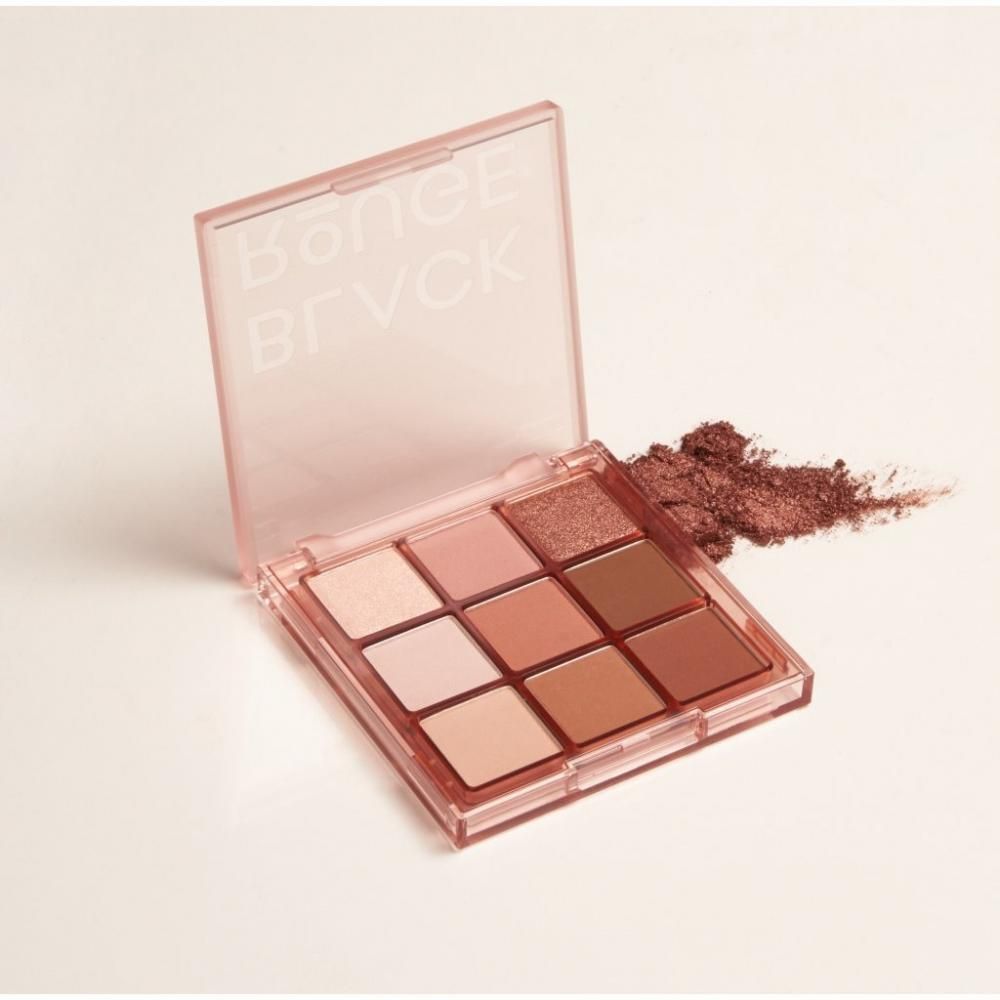 BLACK ROUGE oogschaduwpalet, geopend. Negen tinten in vierkante pannetjes. Roze deksel. Product ernaast.