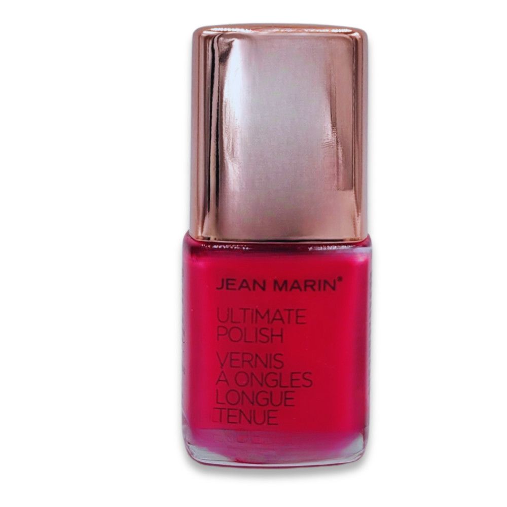 Flacon de vernis à ongles rouge avec bouchon cuivré. Nom et désignation du produit sur l'étiquette.