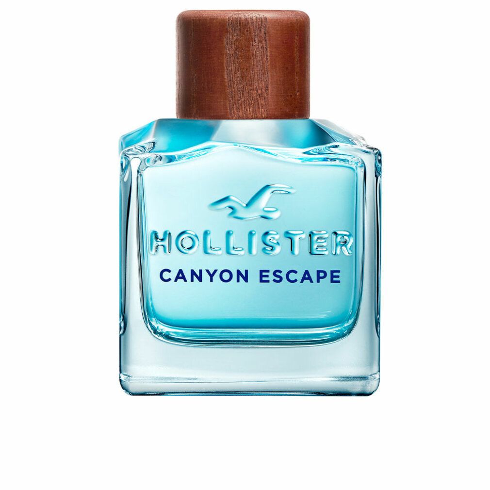Flacon Hollister Canyon Escape Eau de Toilette avec bouchon en bois. Forme carrée, liquide bleu.