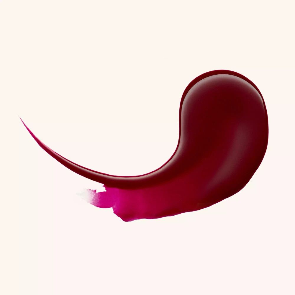 Échantillon de baume à lèvres rouge foncé. Forme : ligne incurvée avec pointe. Arrière-plan : clair.