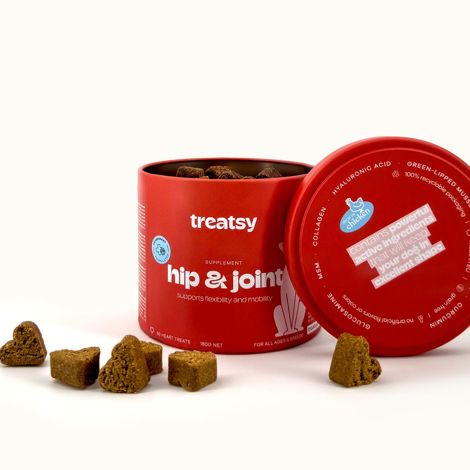 Boîte rouge Treatsy, hip & joint, couvercle ouvert. Friandises en forme de cœur.