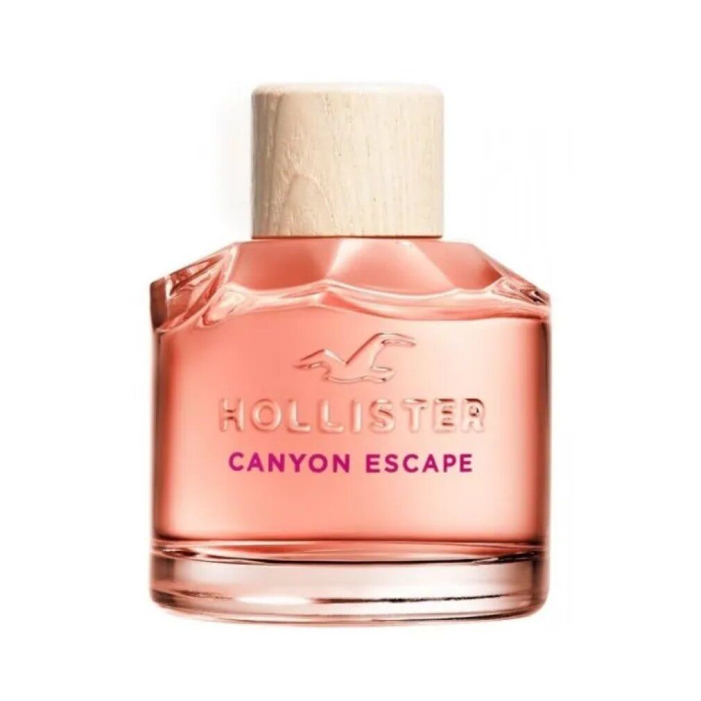 Fles Hollister Canyon Escape Eau de Parfum Spray. Roze vloeistof, houten dop. Logo en productnaam zichtbaar.