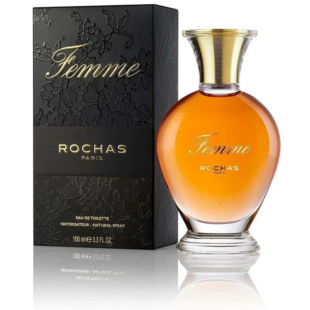Flacon de parfum et boîte. Flacon avec bouchon doré. Inscription "Femme" et "Rochas Paris". Boîte noire avec motif floral.