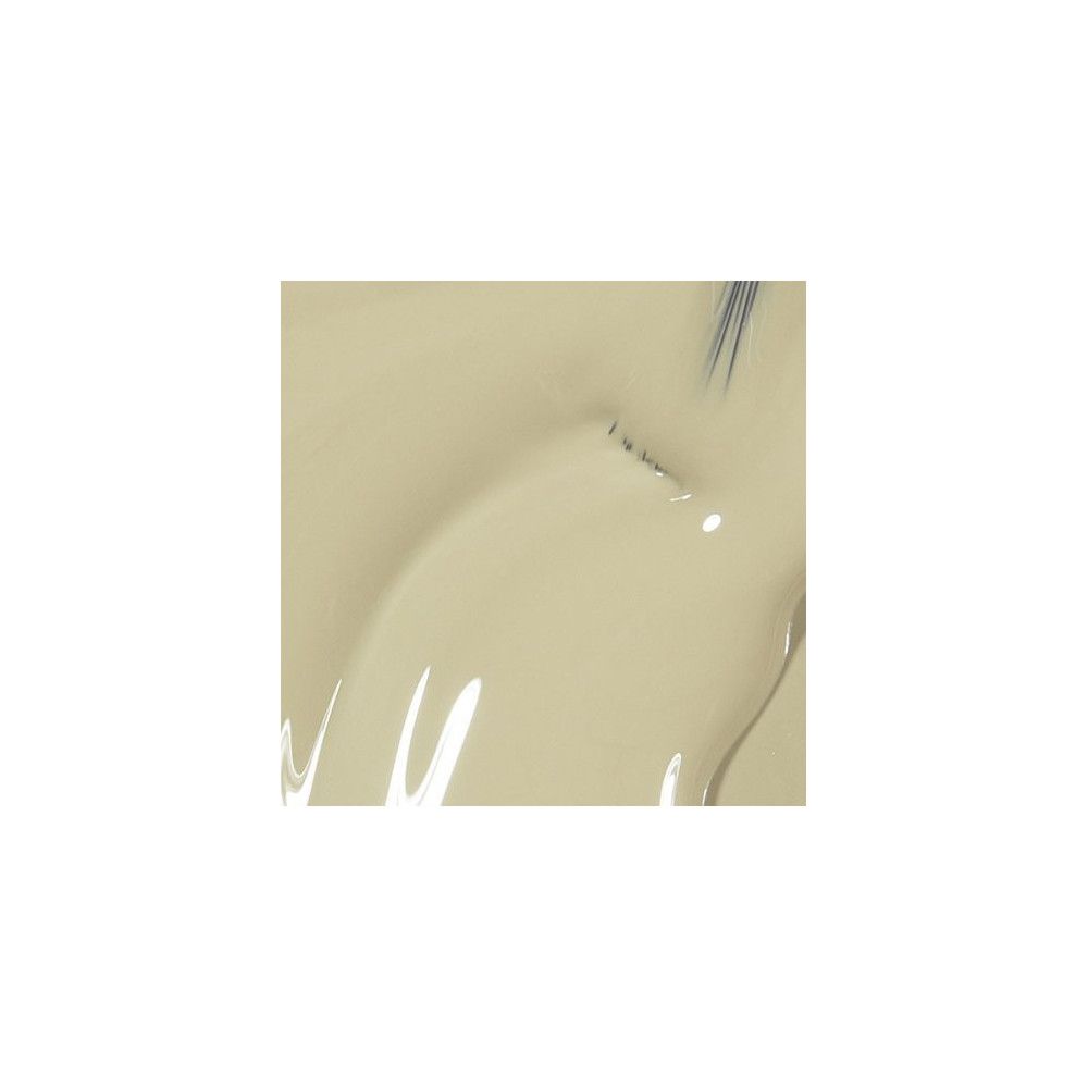 Lichtgele nagellak tint, penseelstreek. Glanzende textuur. Close-up.