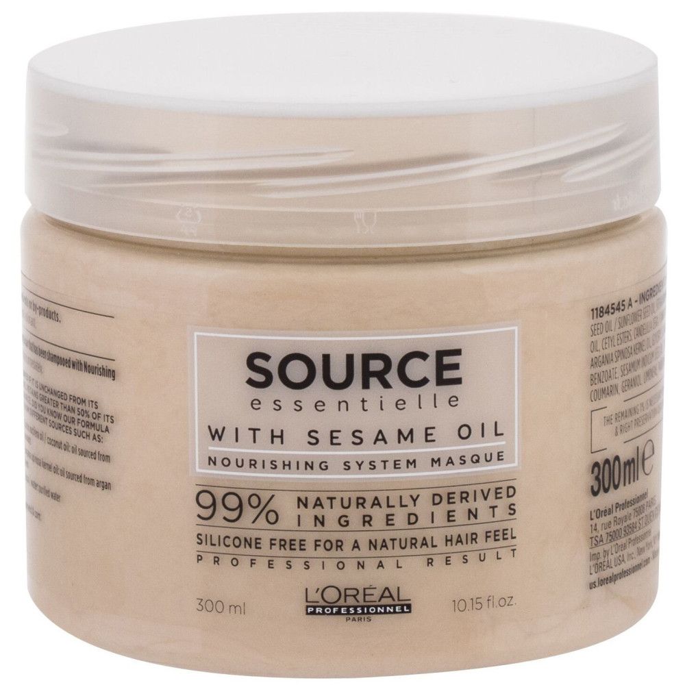 Pot beige avec couvercle blanc. Inscription : Source Essentielle, avec huile de sésame, Nourishing System Masque. 300 ml. L'Oréal Professionnel.