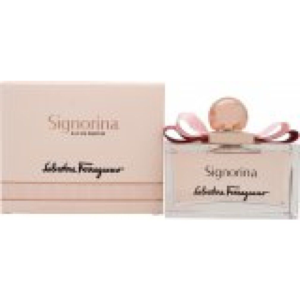 Flacon de parfum avec liquide rose, nœud et bouchon doré. Signorina, Salvatore Ferragamo. Emballage rose à côté.