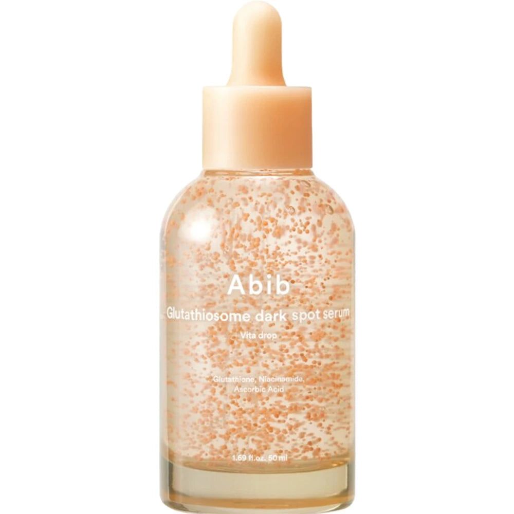 Flacon en verre transparent avec sérum, billes roses, bouchon beige et pipette. Inscription : Abib Glutathiosome dark spot serum.