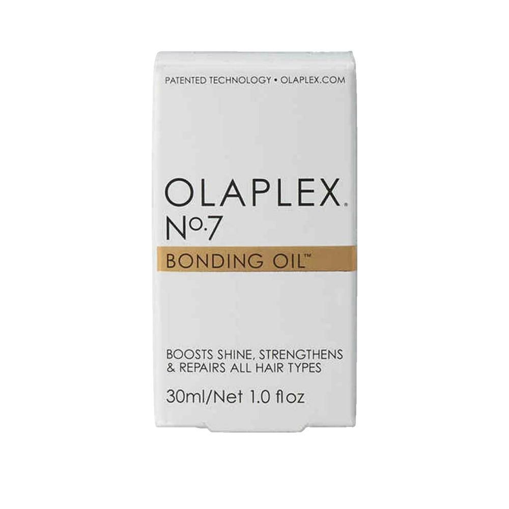 Olaplex Nr. 7 Bonding Oil. Witte verpakking met productinfo. Tekst: Boosts Shine, Strengthens & Repairs All Hair Types.