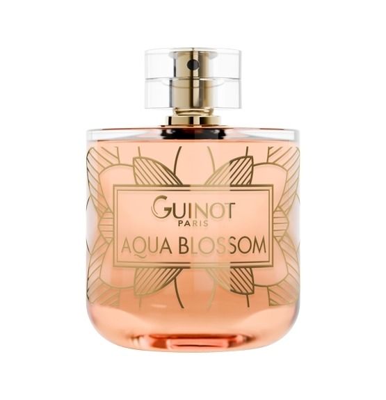 Parfumfles met gouden dop. Opschrift: Guinot Aqua Blossom. Roze vloeistof, bloemenmotief.