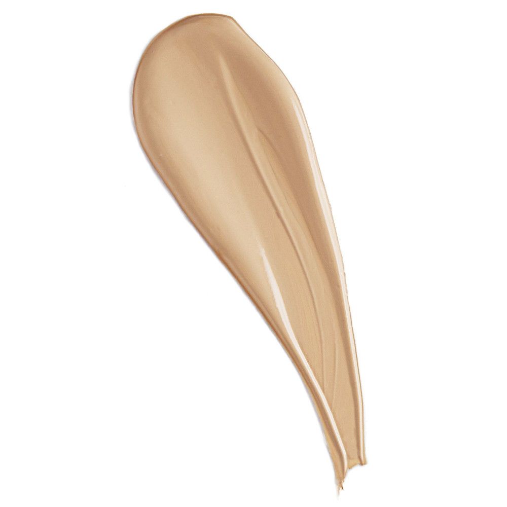 Échantillon de correcteur clair sur fond blanc. Texture visible.