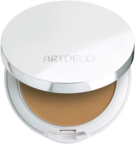 Compacte foundation met deksel. Witte behuizing, zilveren rand. Opschrift ARTDECO. Crèmefoundation in lichte tint.