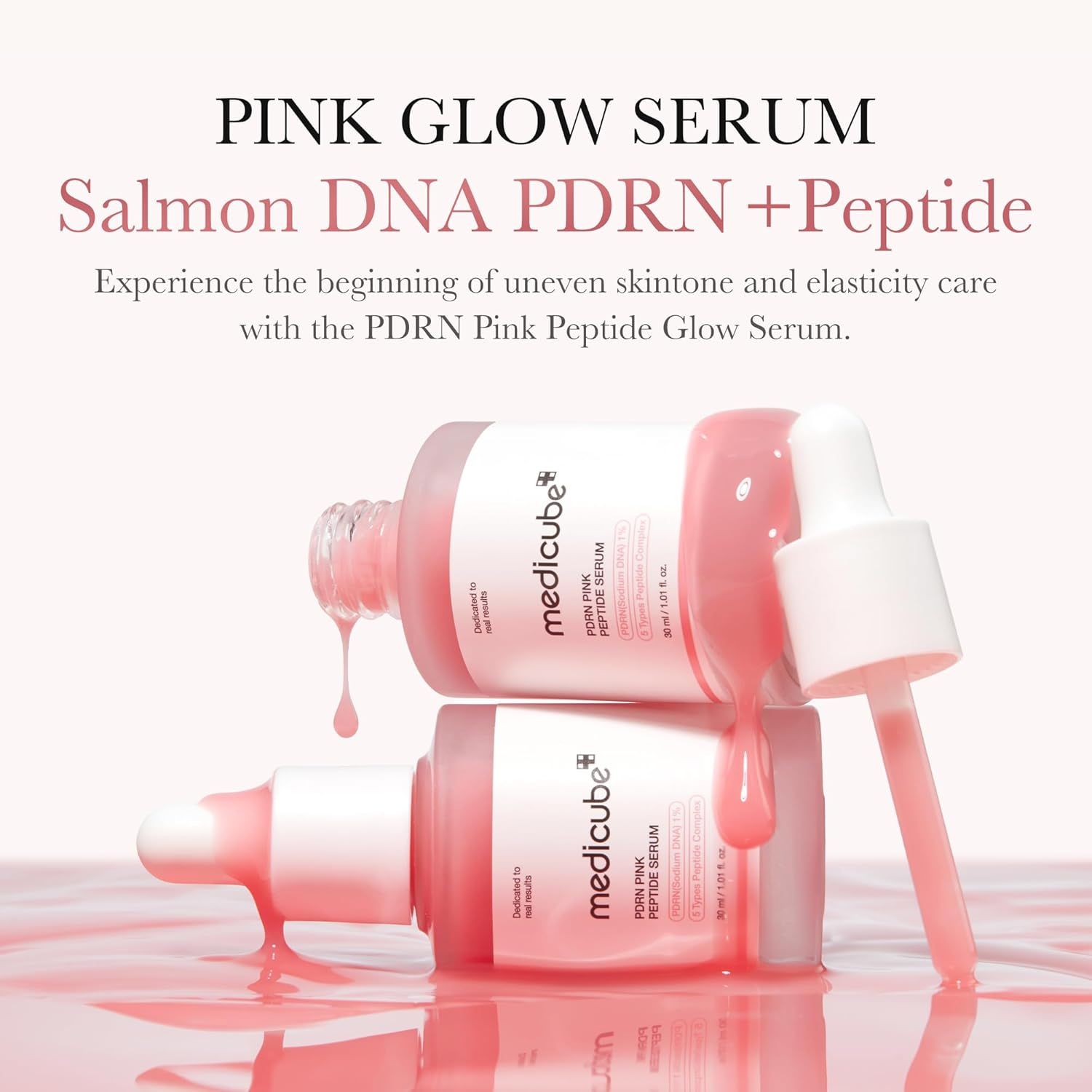Deux flacons de sérum rose avec pipettes. Liquide qui coule. Inscription : Medicube PDRN Pink Peptide Serum.