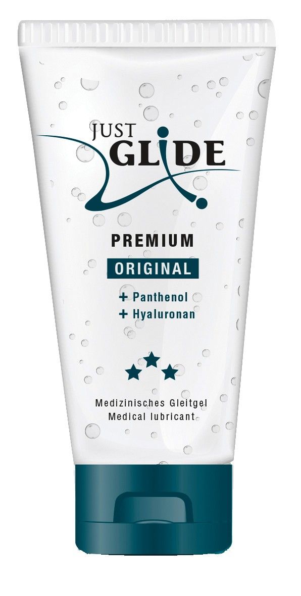 Tube transparent avec bouchon bleu. Inscription : JUST GLIDE PREMIUM ORIGINAL. Contient du panthénol et de l'hyaluronan. Lubrifiant médical.