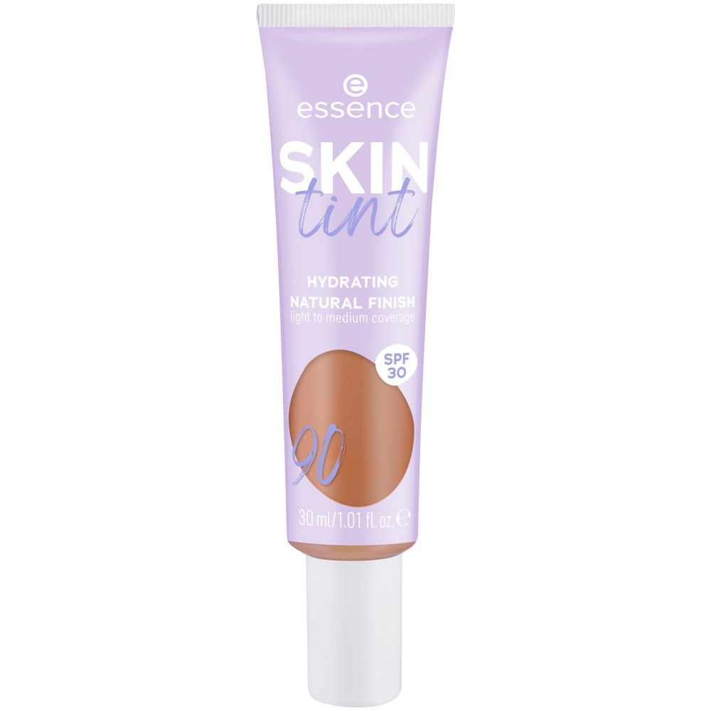 Tube de fond de teint Skin Tint. Tube lilas avec bouchon blanc. Inscription : Skin Tint, SPF 30. Teinte 90.