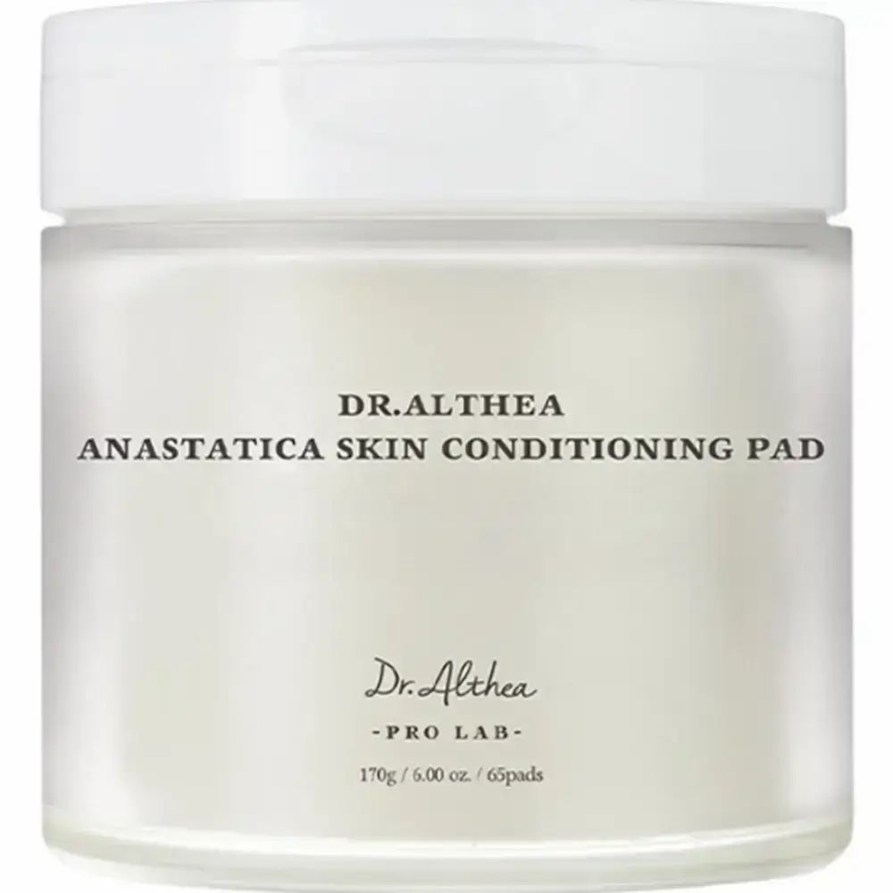 Pot rond blanc avec couvercle. Inscription : Dr. Althea Anastatica Skin Conditioning Pad, 170g / 6.00 oz. / 65 pads.