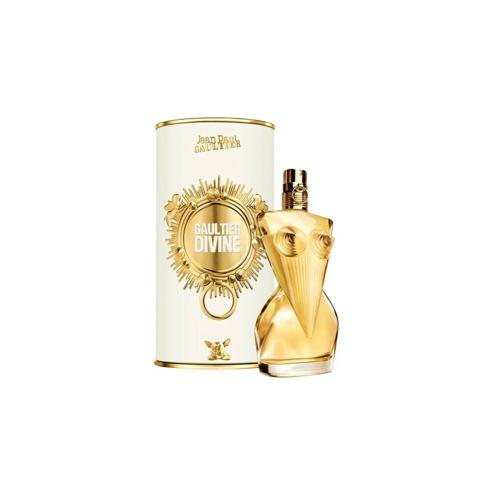 Parfumfles en verpakking. Gouden fles in de vorm van een bovenlichaam. Witte cilindrische verpakking met gouden details en tekst.