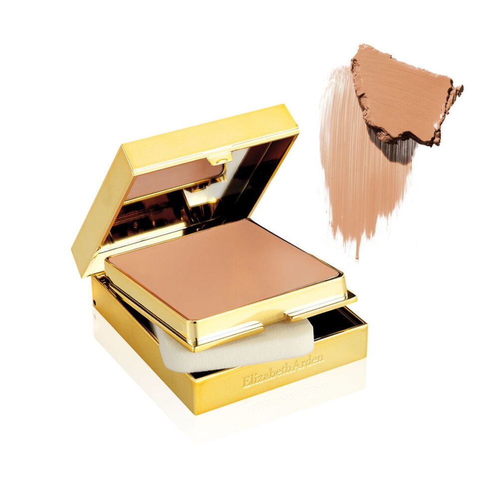 Boîtier de maquillage doré ouvert avec poudre, éponge et échantillon de couleur. Elizabeth Arden.