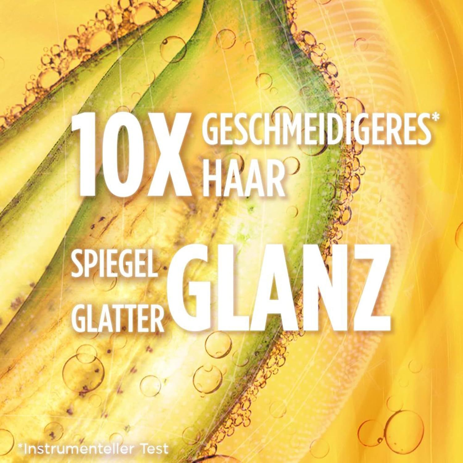 Tekst "10X zachter haar" en "spiegelglans" op gele achtergrond met bellen.