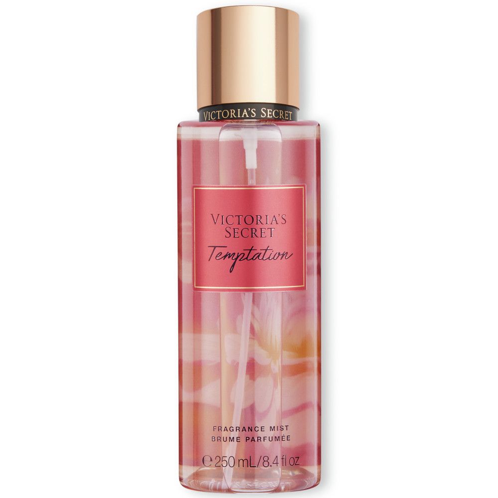 Vaporisateur de brume parfumée Victoria's Secret Temptation. Flacon rose avec bouchon doré. Texte : Victoria's Secret, Temptation.