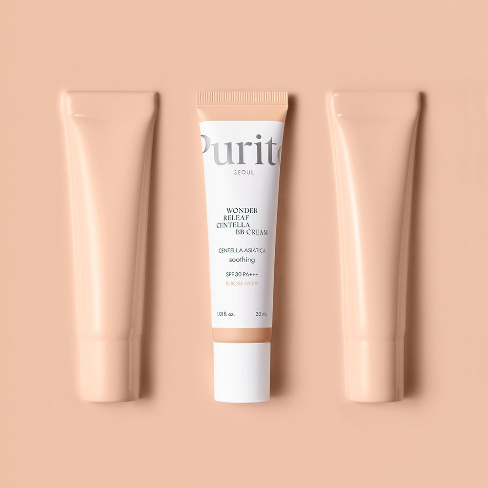 Purito Wonder Releaf Centella BB Cream, 15 Rose Ivory, geflankeerd door twee lege tubes.