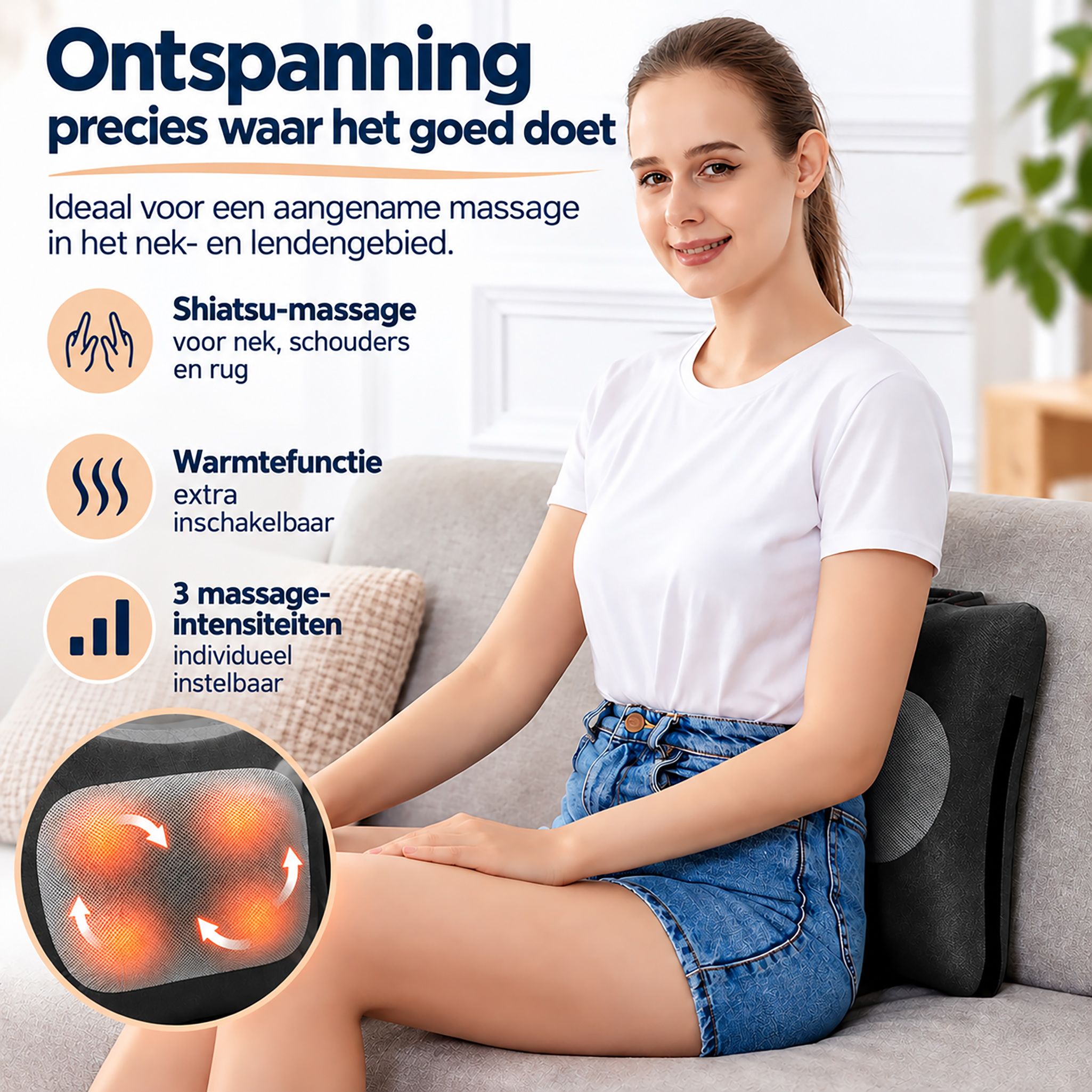 Grijs Shiatsu massagekussen met vier gloeiende massagekoppen, liggend op een fauteuil.