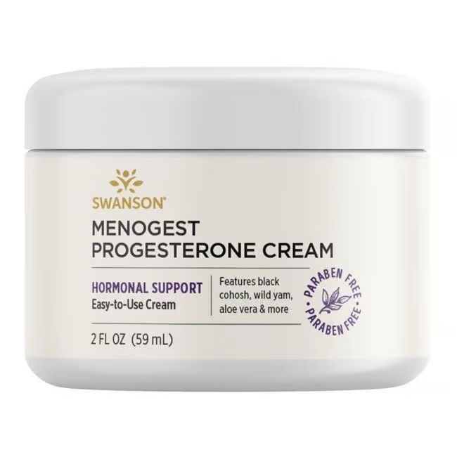 Pot blanc avec inscription SWANSON Menogest Progesterone Cream. Soutien hormonal. 2 FL OZ (59 ml). Sans parabène.