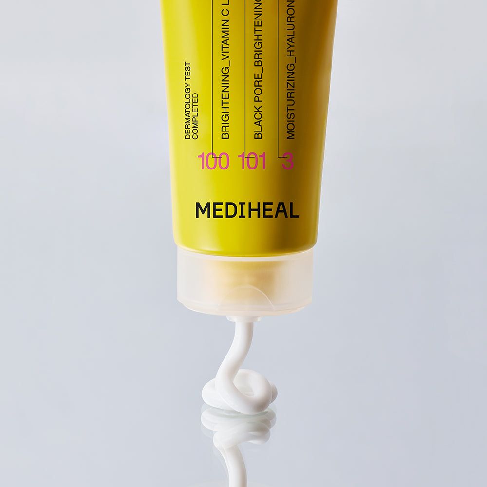 Tube met wit product. Opschrift: MEDIHEAL. Gele strook met tekst. Product komt uit de tube.
