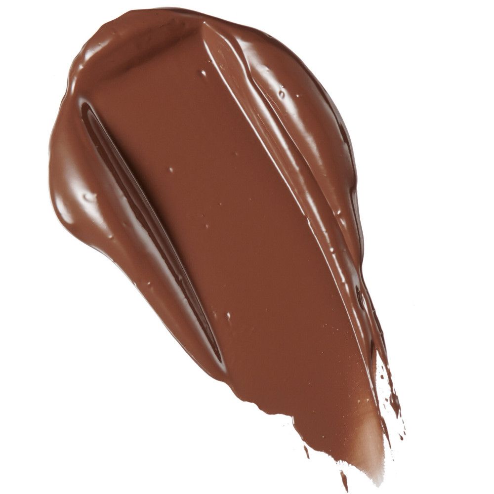 Nuance de correcteur brun. Texture liquide, sur fond blanc. Forme d'une goutte.