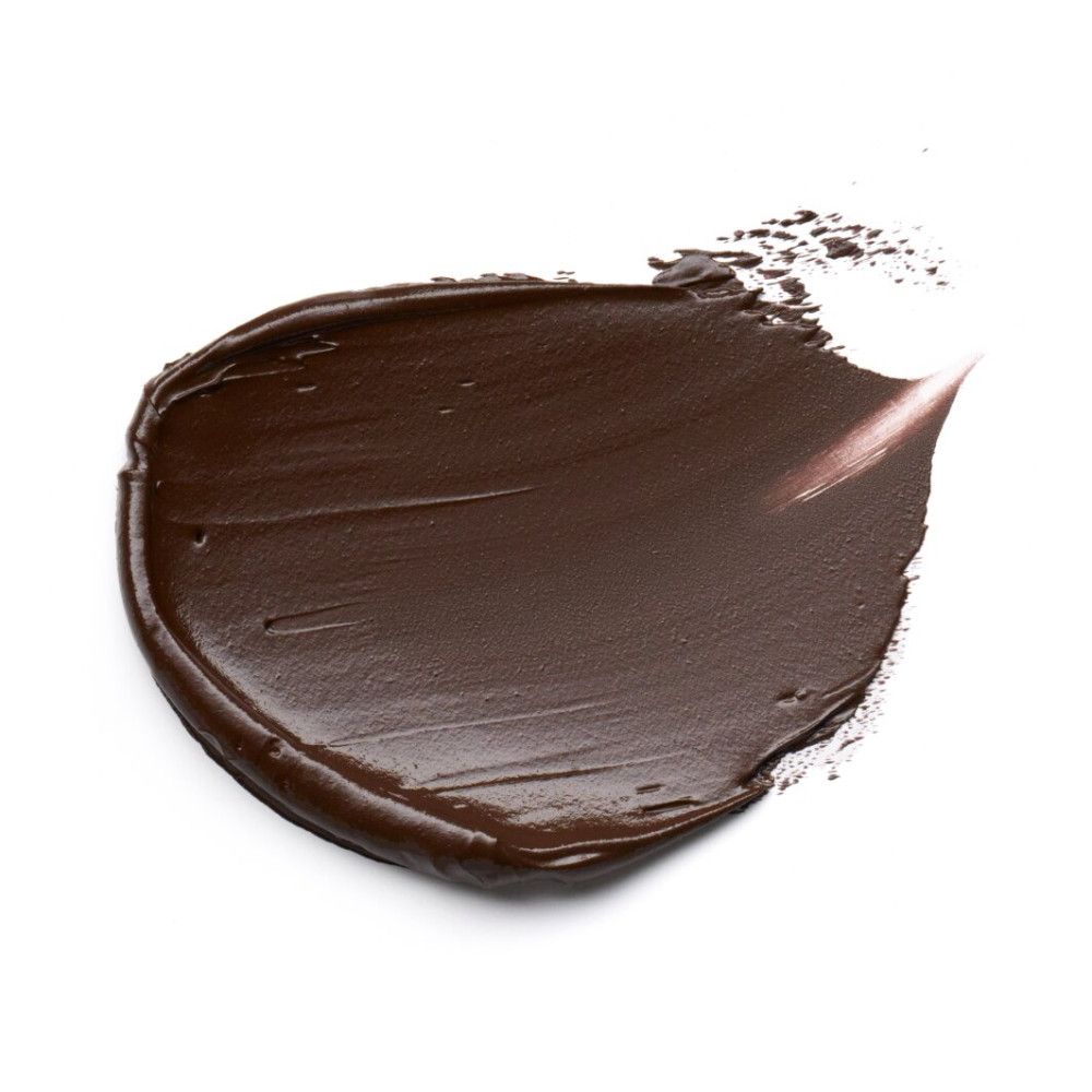 Échantillon de couleur Foundation Stick. Texture brun foncé sur fond blanc.