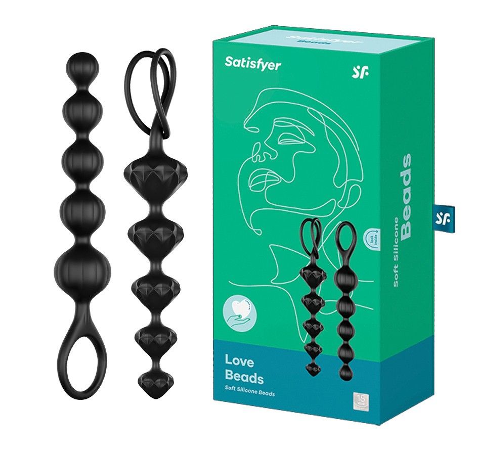 Deux chaînes de perles d'amour en silicone noir aux formes variées, avec une boucle. À côté, la boîte verte avec l'image du produit.