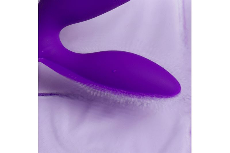 Paars product met gebogen ontwerp. Zachte, afgeronde vorm. Op witte achtergrond.