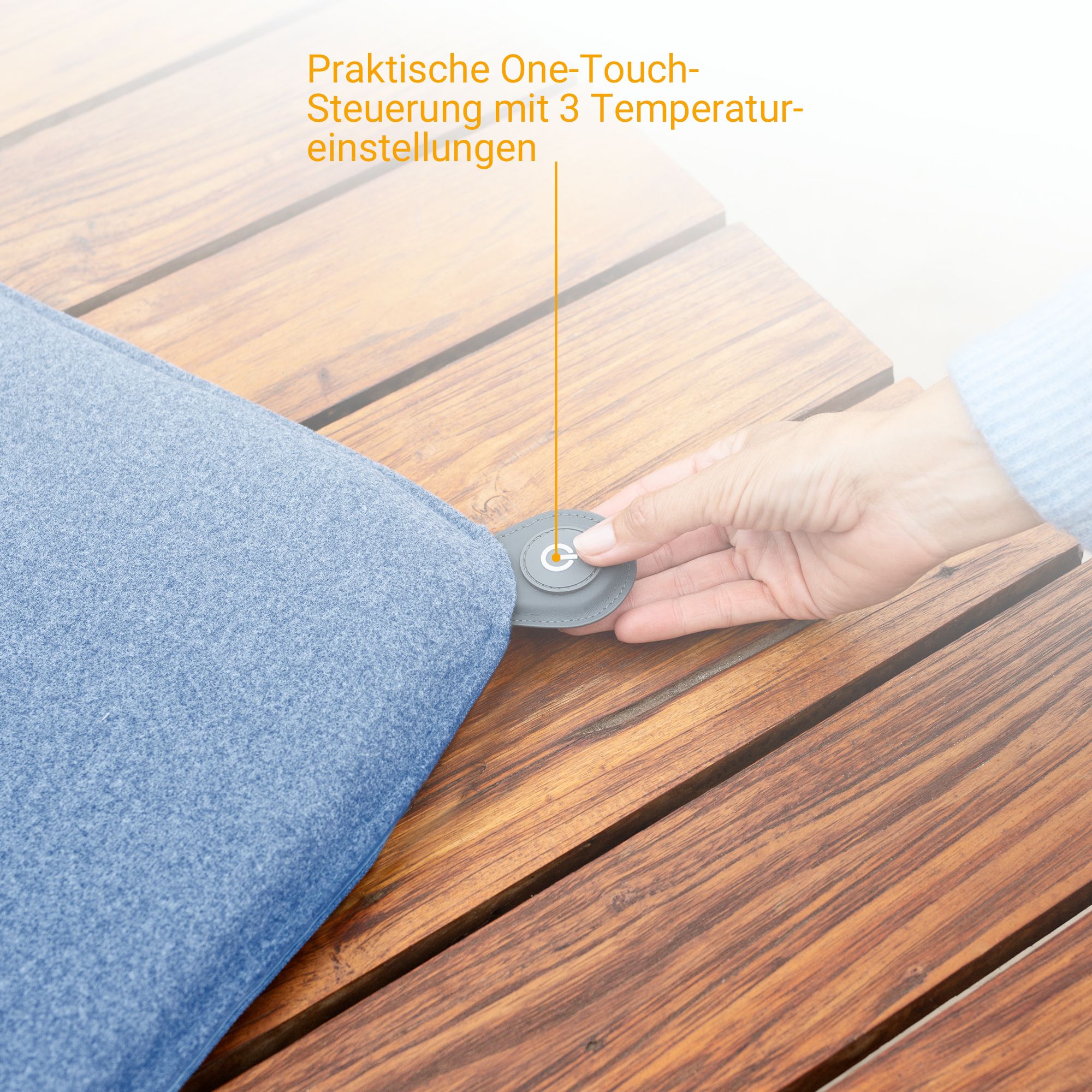 Gros plan de l'élément de commande d'un coussin chauffant bleu avec commande One-Touch.