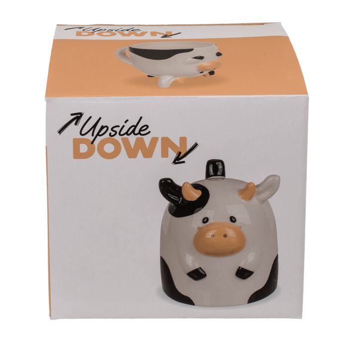 Koe-mok in verpakking. Wit, zwart en beige. Opschrift "Upside Down".