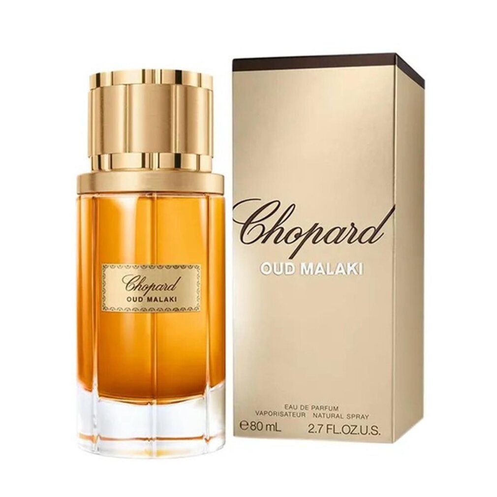 Flacon de parfum et emballage. Inscription "Chopard Oud Malaki". Emballage doré, flacon avec liquide doré.