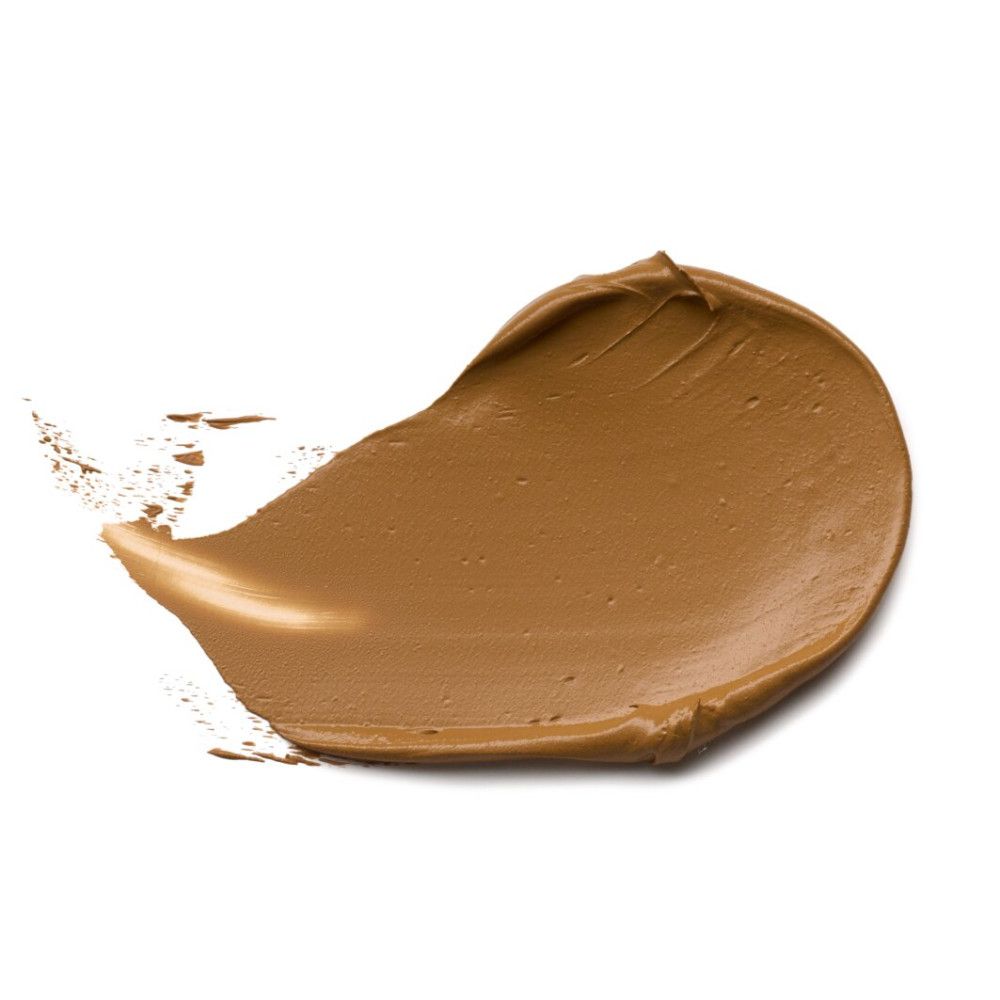 Bruine foundation-veeg op witte achtergrond. Textuur zichtbaar.