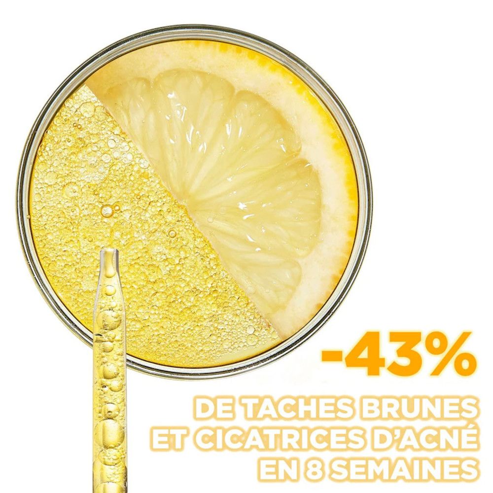 Citron dans une boîte de Pétri avec sérum et pipette. Texte: -43% DE TACHES BRUNES ET CICATRICES D'ACNÉ EN 8 SEMAINES.
