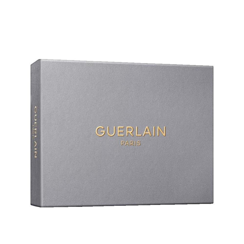 Coffret cadeau rectangulaire gris. Inscription dorée Guerlain Paris. Guerlain sur le côté.