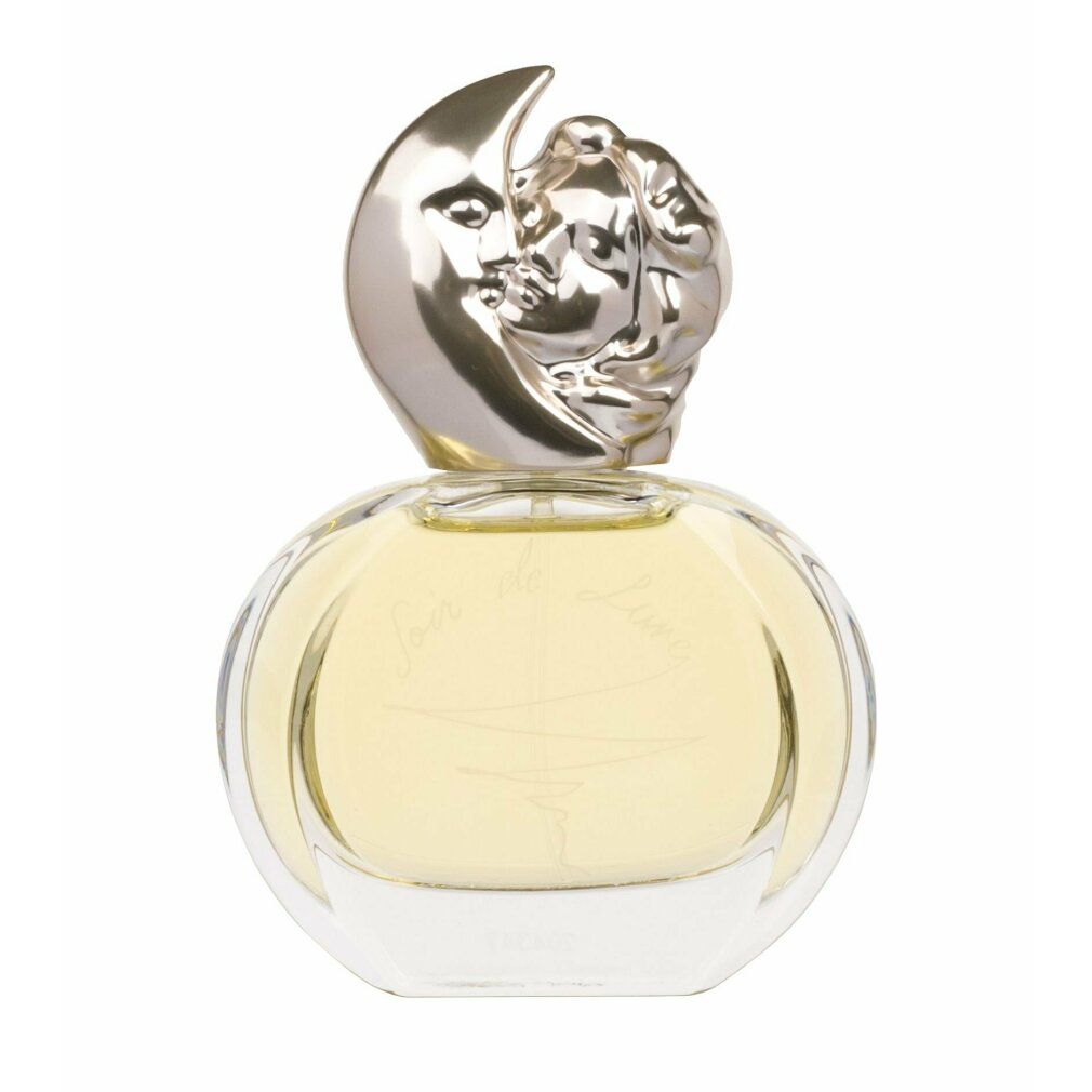 Flacon rond en verre avec bouchon argenté en forme de lune et visage féminin. Inscription "Soir de Lune".