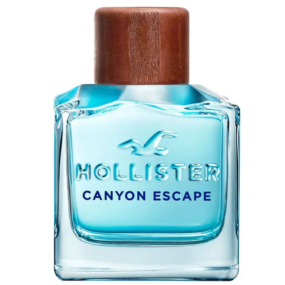 Flacon Hollister Canyon Escape Eau de Toilette avec bouchon en bois. Forme carrée, liquide bleu.