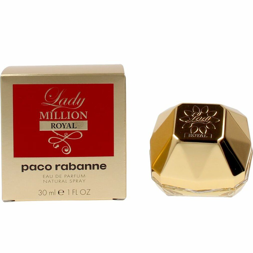 Flacon doré à côté de la boîte "Lady Million Royal".