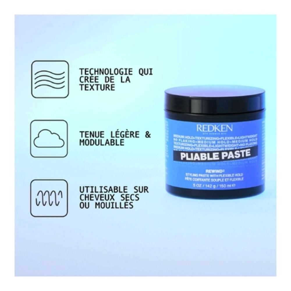 Blauwe pot met zwarte deksel. Opschrift: Redken Pliable Paste. Texturerende pasta voor flexibele styling. Franse tekst.