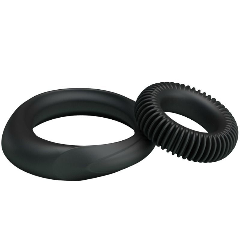 Deux anneaux noirs en silicone, un lisse et un côtelé, vus sous un léger angle.