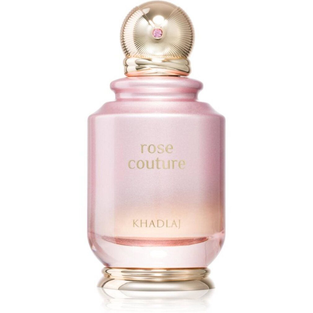 Flacon de parfum rose avec un bouchon doré côtelé et une pierre rose.